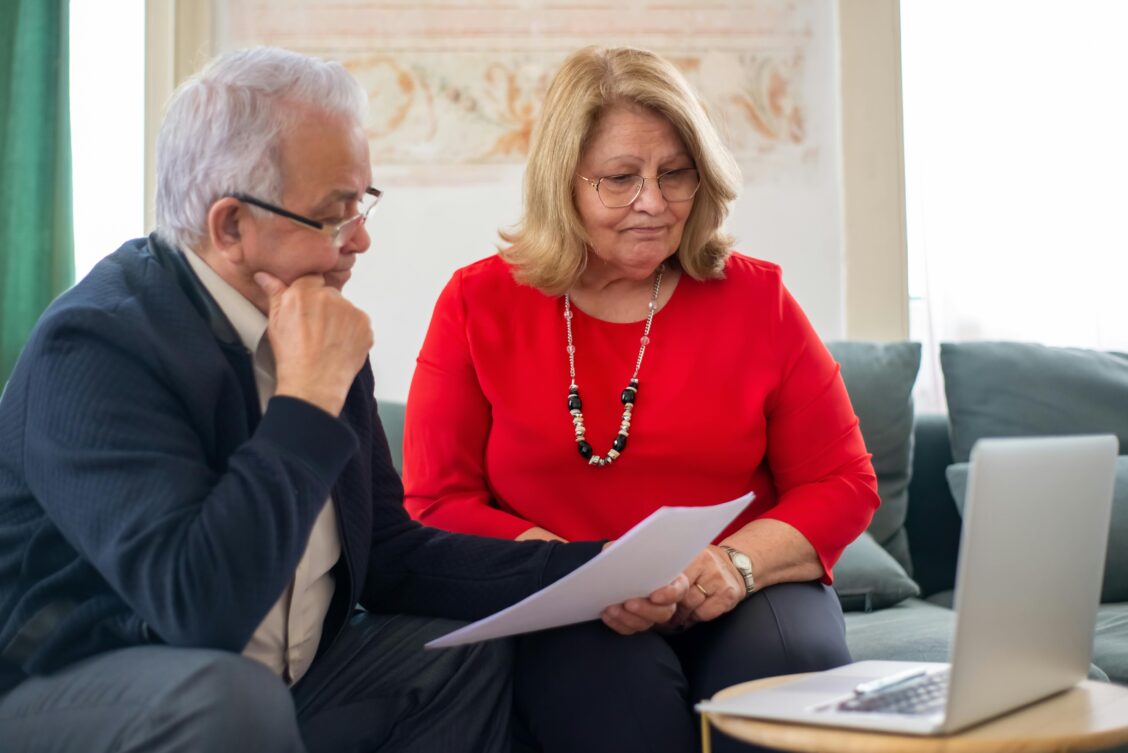 old couple checking insurance