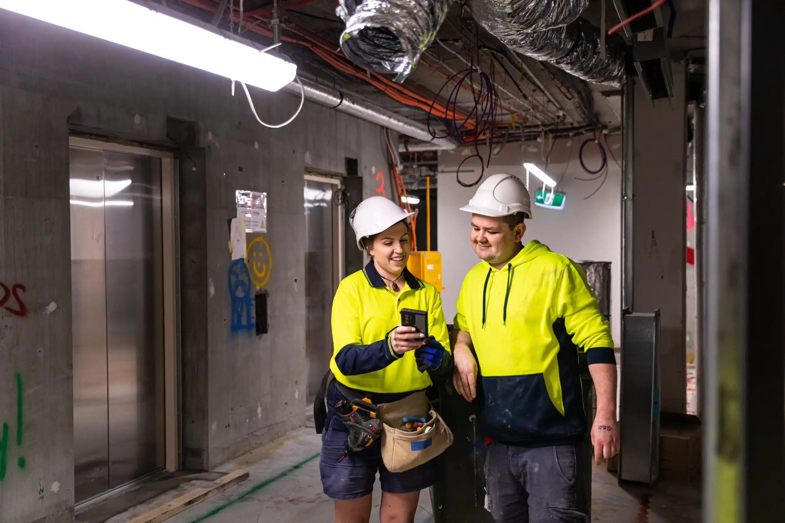 Real life female electrician and her coworker at work